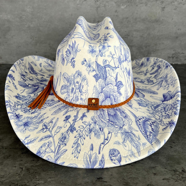 611fc05e3c4ce80992caae23_blue-chinoiserie-ivory-cattleman-cowboy-back_1776441558301.jpg