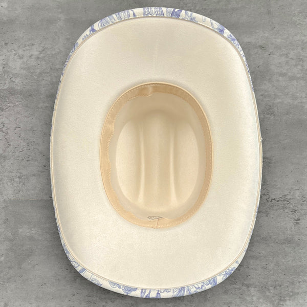 611fc05e3c4ce80992caae23_blue-chinoiserie-ivory-cattleman-cowboy-base_1776441547168.jpg