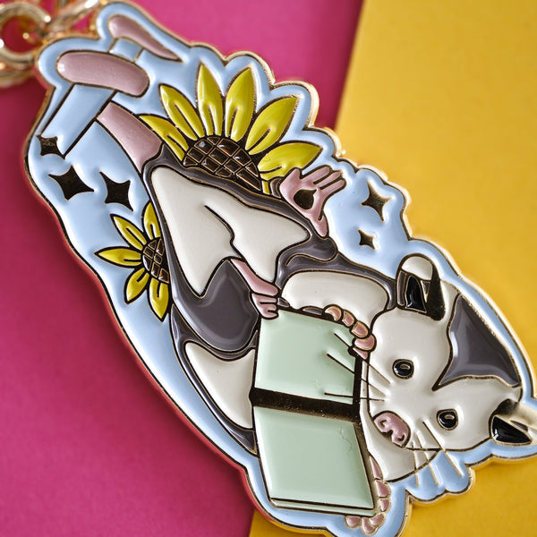 611fc05e3c4ce80992caae23_book-opossum-keychain-2_1790815911175.jpg
