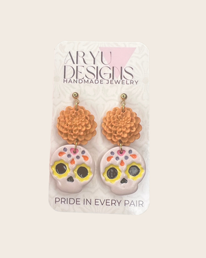 611fc05e3c4ce80992caae23_sugar-skull-marigold-earrings-card_1790624257249.png