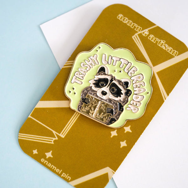 611fc05e3c4ce80992caae23_trashy-little-reader-racoon-pin-6_1790864758950.jpg